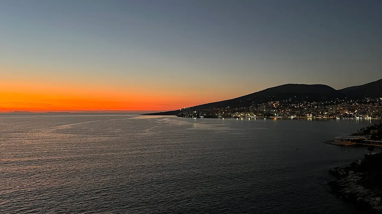 View over Saranda bay and the Ionian Sea, with the town stepping up the hillside above the waterfront